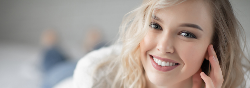 Young blonde woman smiling