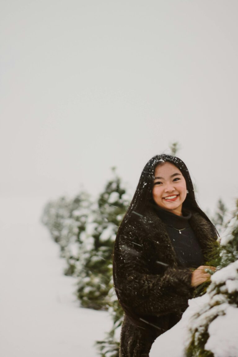 Toronto woman smiling in the snow after visiting cosmetic dentistry near me